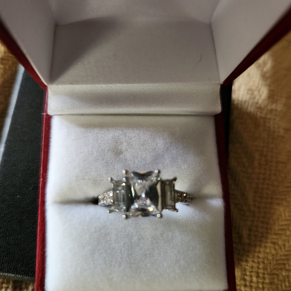 3 Stone Emerald Cut Diamond ring